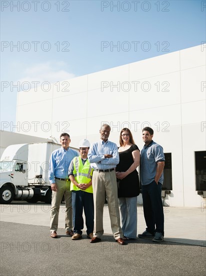 Portrait of warehouse workers and managers.
