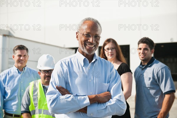 Portrait of warehouse workers and manager.