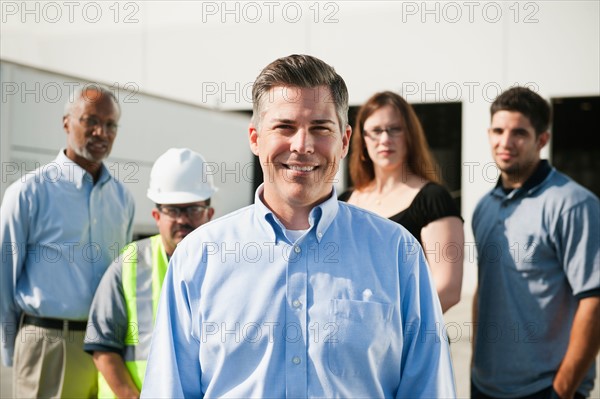 Portrait of warehouse workers and manager.