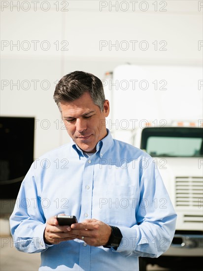 Businessman texting.