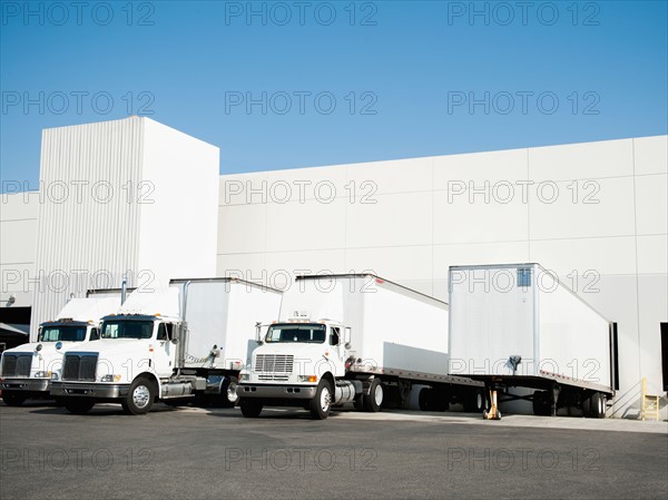 Trucks and warehouse.