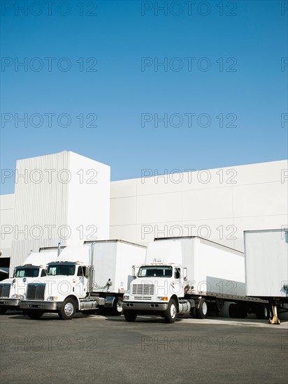 Trucks and warehouse.