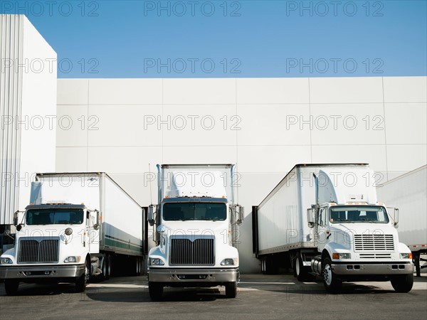 Trucks and warehouse.