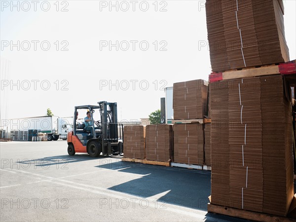 Forklift truck moving pallets.