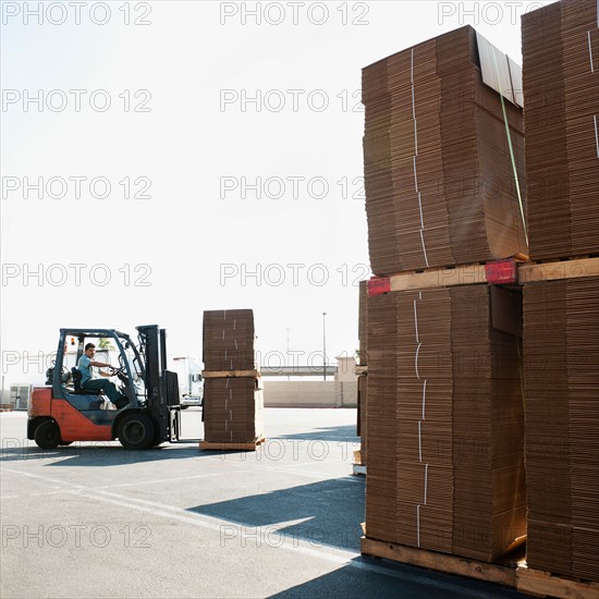 Forklift truck moving pallets.