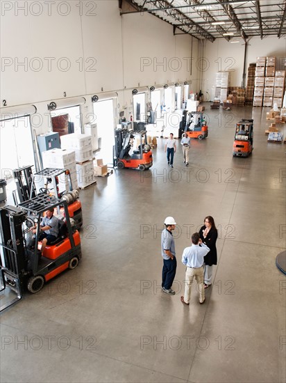 People working in warehouse.