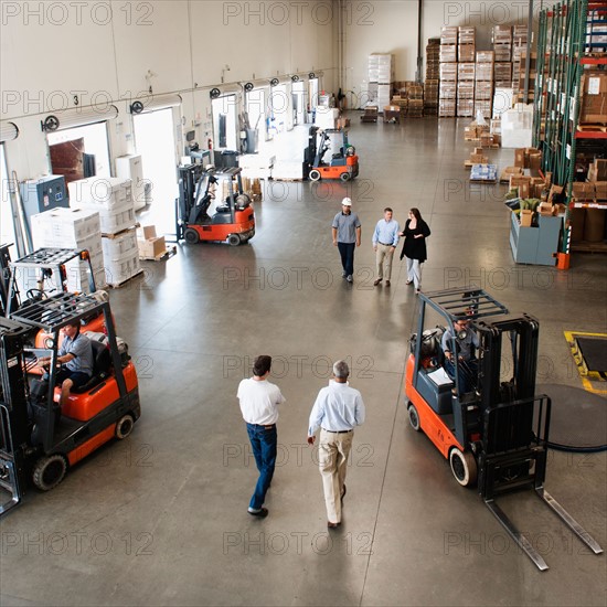 People working in warehouse.