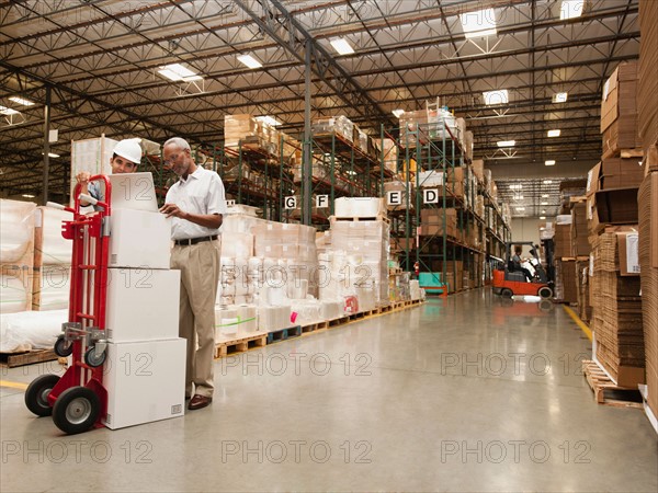 Men working in warehouse.