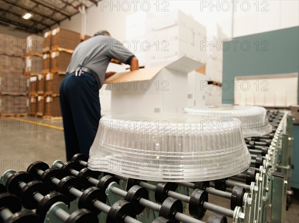 Warehouse worker assembling merchandise.