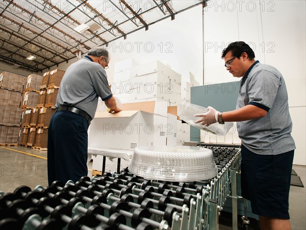 Warehouse workers assembling merchandise.