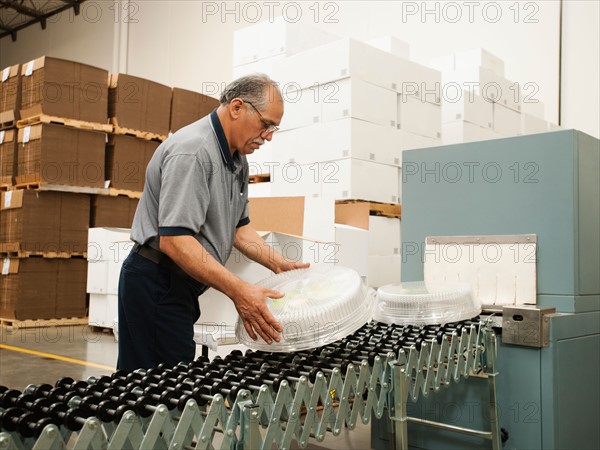 Warehouse worker assembling merchandise.