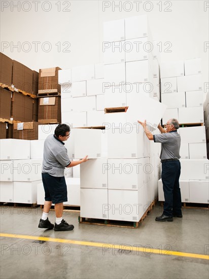 Warehouse worker inspecting delivery.