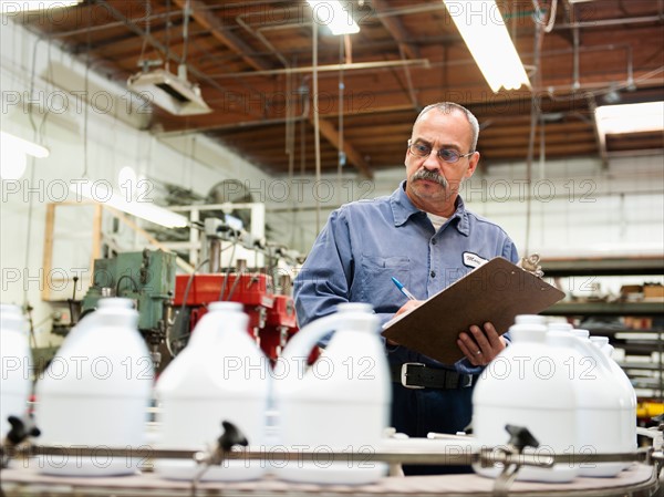 Warehouse worker checking merchandise.