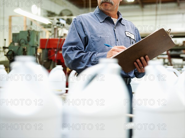 Warehouse worker checking merchandise.