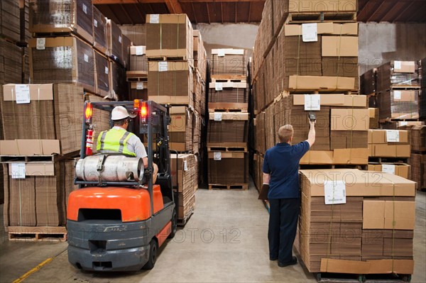 People working in warehouse.