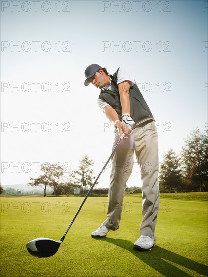 USA, California, Mission Viejo, Low angle view of man playing golf.