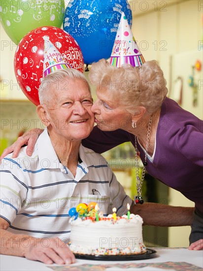 Senior couple celebrating birthday.