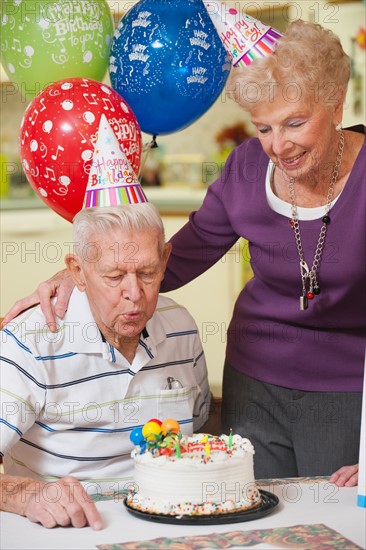 Senior couple celebrating birthday.