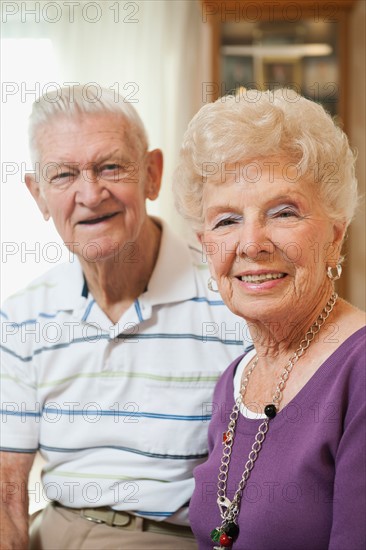 Portrait of senior couple smiling.