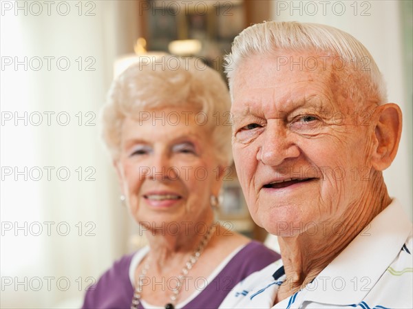 Portrait of senior couple smiling.