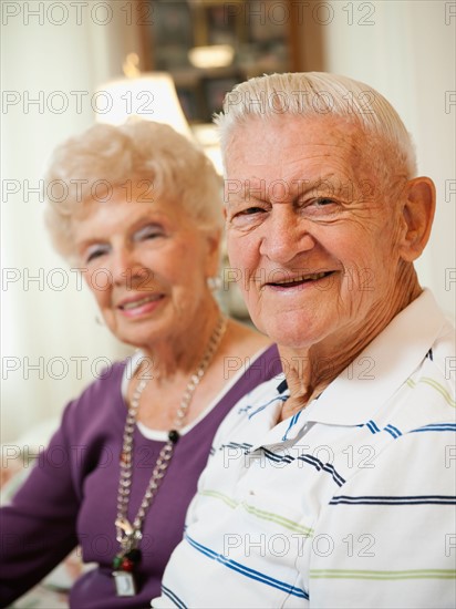 Portrait of senior couple smiling.