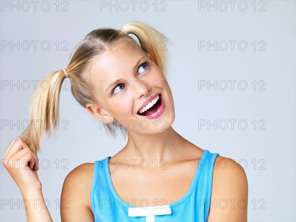 Studio portrait of young woman. Photo : Yuri Arcurs