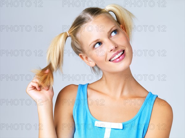 Studio portrait of young woman. Photo : Yuri Arcurs