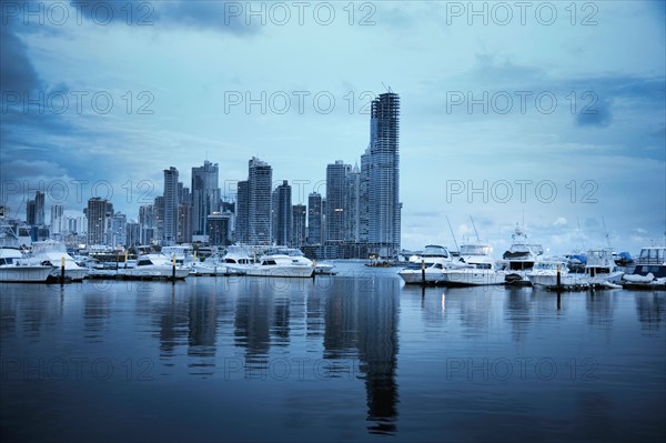 Panama, Panama City, Boats with skyline in background. Photo : DreamPictures