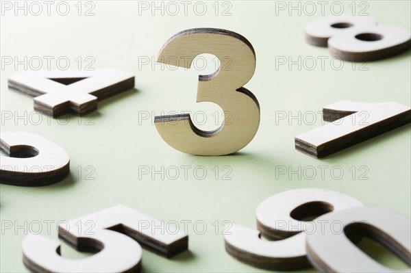 Numbers on white background, studio shot. Photo : Kristin Lee