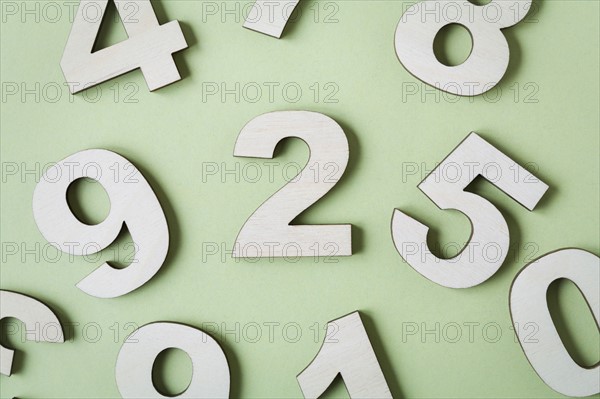 Numbers on white background, studio shot. Photo : Kristin Lee