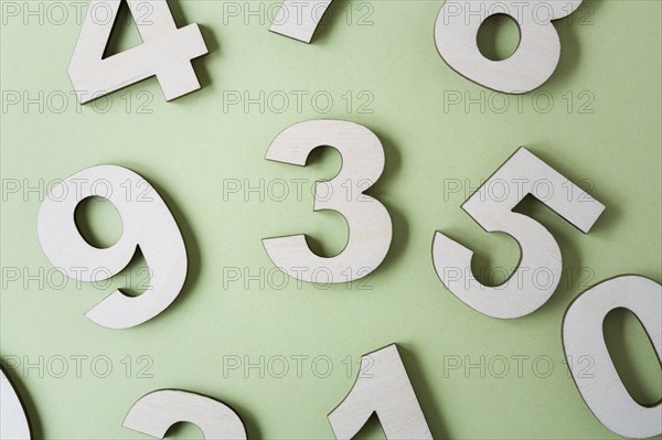 Numbers on white background, studio shot. Photo : Kristin Lee