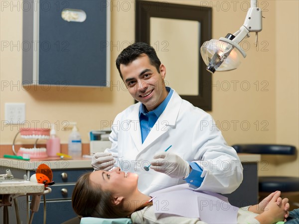 Dentist and patient in dental surgery. Photo : Dan Bannister