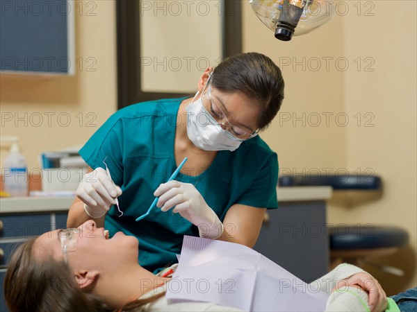 Dentist and patient in dental surgery. Photo : Dan Bannister