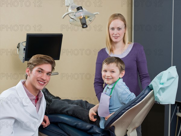 Dentist and patients in dental surgery. Photo : Dan Bannister