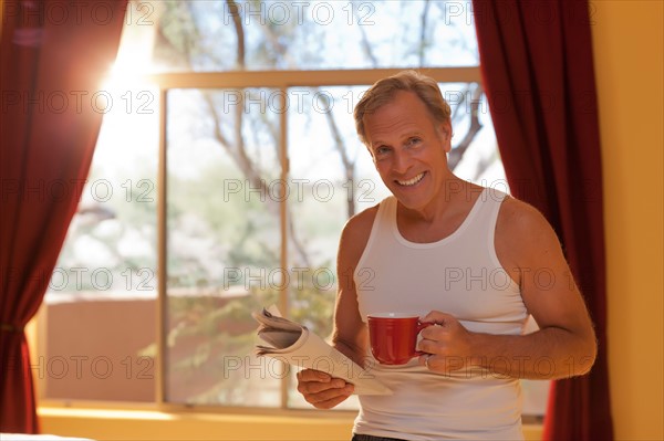 Portrait of man in bedroom. Photo : db2stock