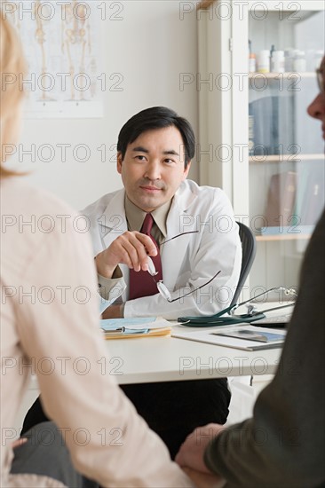 Doctor listening to patients. Photo : Rob Lewine