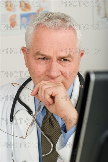 Doctor working on computer. Photo : Rob Lewine