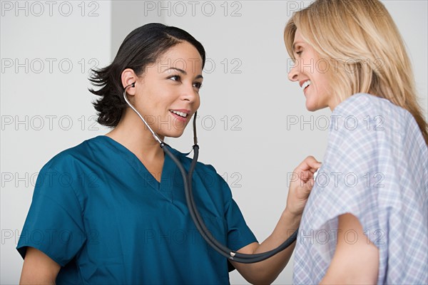 Doctor examining patient. Photo : Rob Lewine