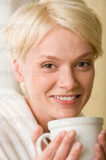 Woman enjoying cup of tea. Photo : Rob Lewine