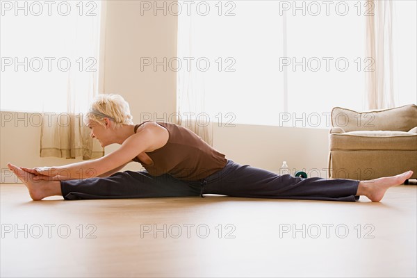 Woman stretching. Photo : Rob Lewine