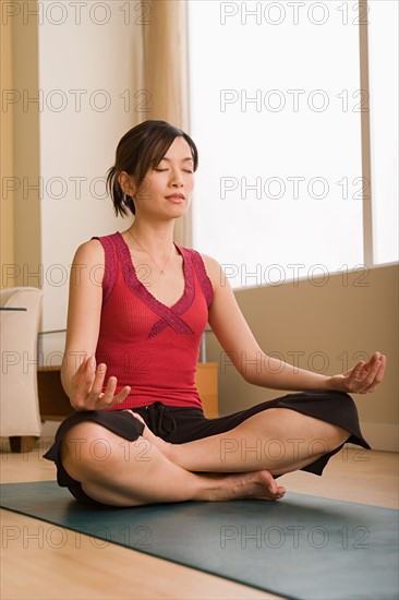 Woman in yoga pose. Photo : Rob Lewine