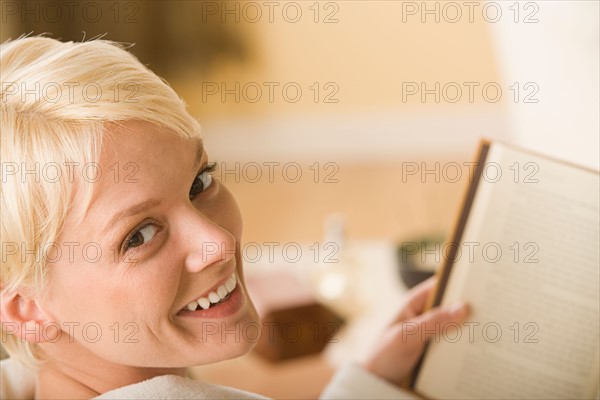 Woman reading book. Photo : Rob Lewine