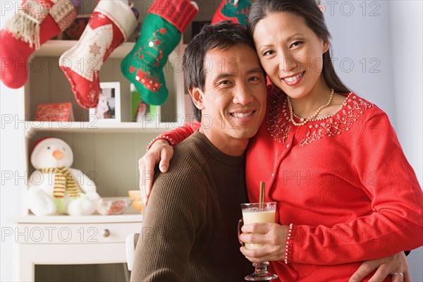 Portrait of couple enjoying christmas time. Photo : Rob Lewine