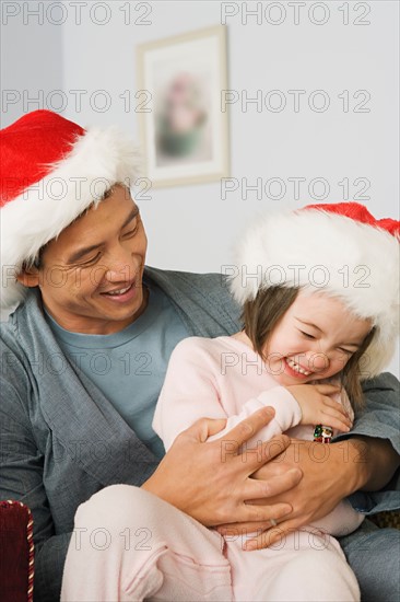 Father playing with daughter. Photo : Rob Lewine