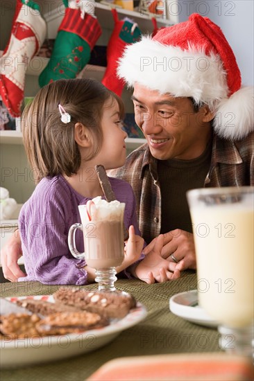 Father and daughter at Christmas morning. Photo : Rob Lewine