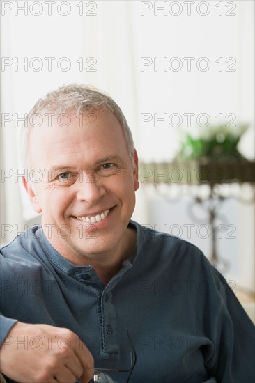 Portrait of smiling mature man. Photo : Rob Lewine