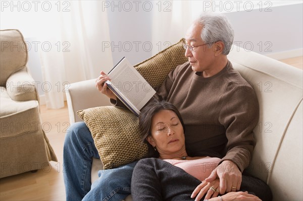 Couple relaxing on sofa. Photo : Rob Lewine