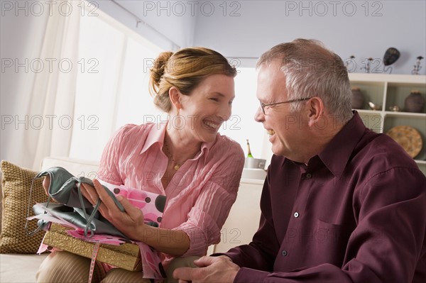 Woman unpacking gift. Photo : Rob Lewine