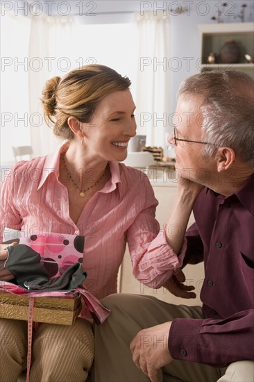 Woman unpacking gift. Photo : Rob Lewine