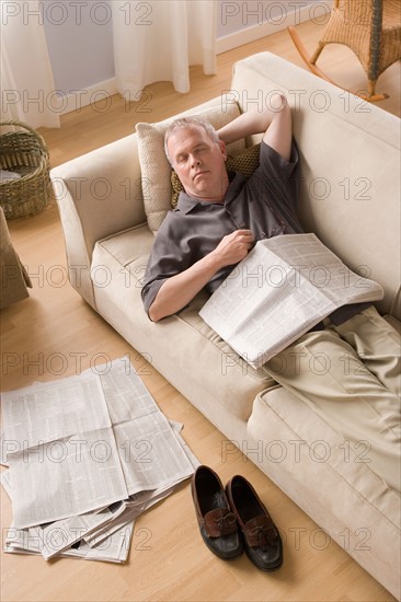 Man having nap on couch. Photo : Rob Lewine